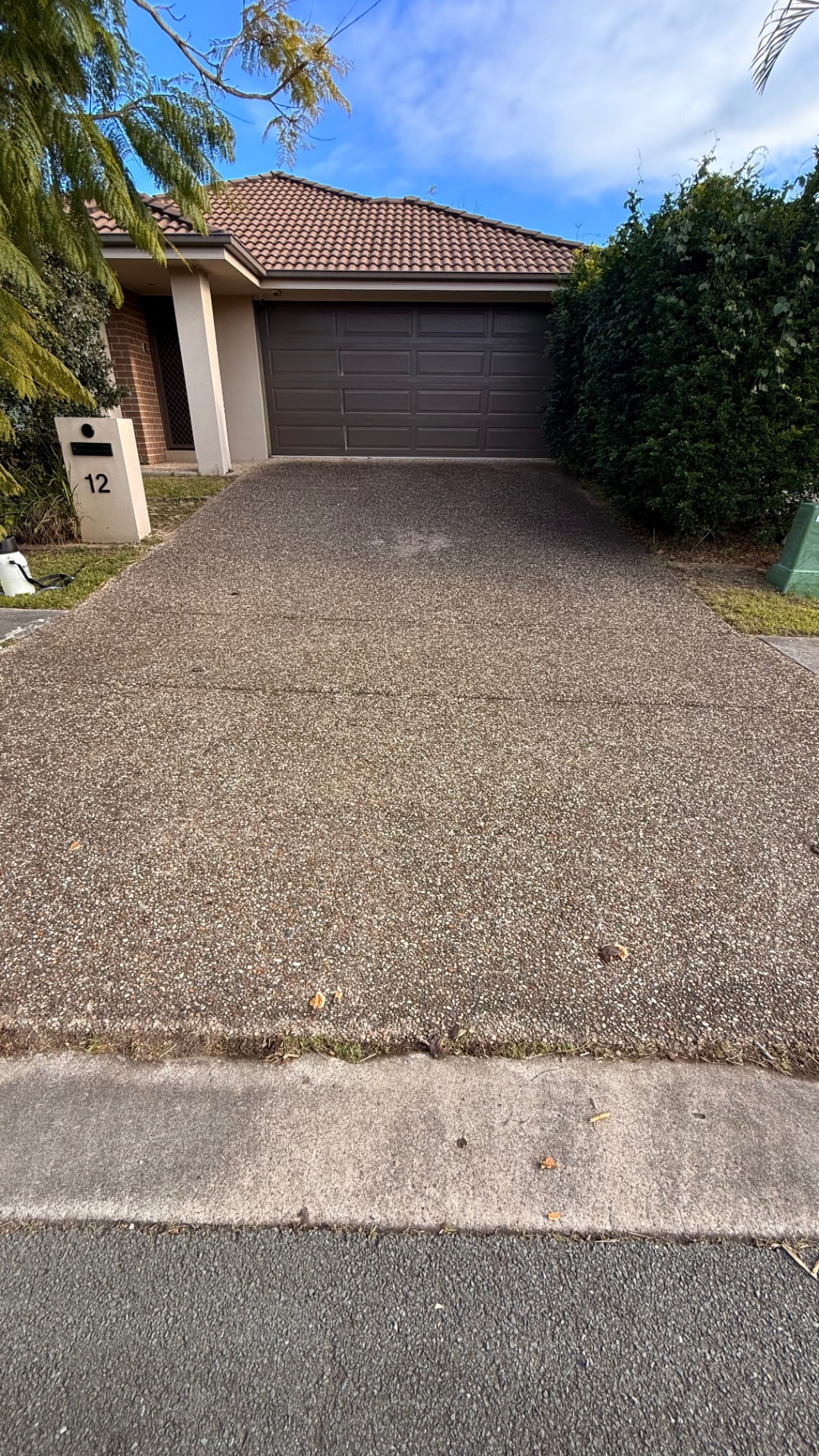 Exposed aggregate driveway before